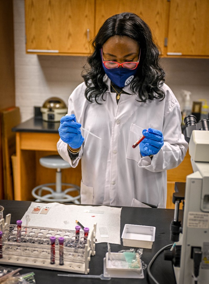 Caroline Obi conducts research on a white-tailed deer specimen for a tick-borne disease while studying at Fort Valley State University in the Master of Public Health Program.