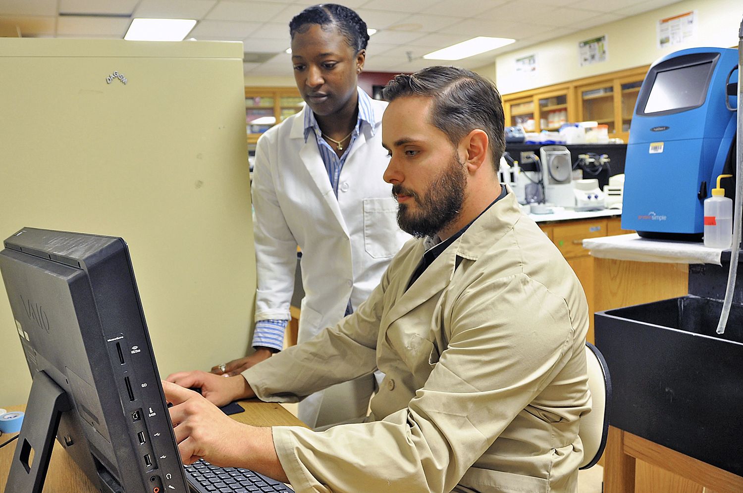 Biotechnology graduate students Zandria Chambers and Matthew Durst-Scarlett, who aspire to be research scientists, apply their coding skills to their research projects.