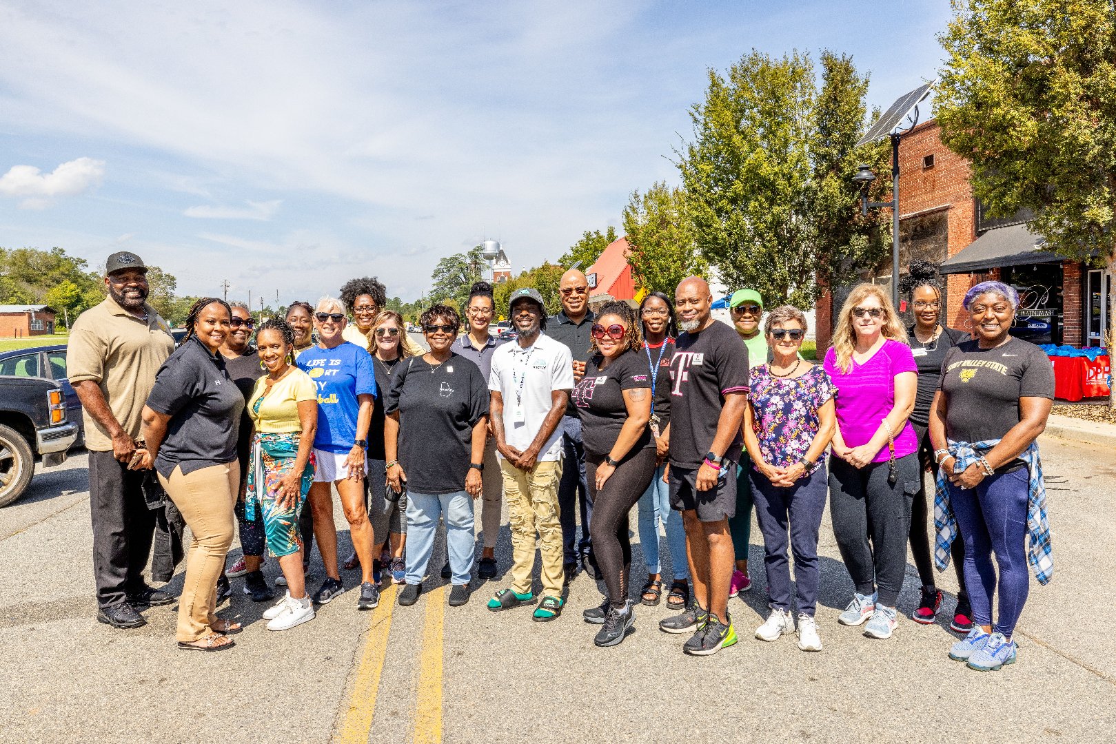 Participants of the Stepping into Fall Walkathon pose as a group in Jeffersonville, Georgia.