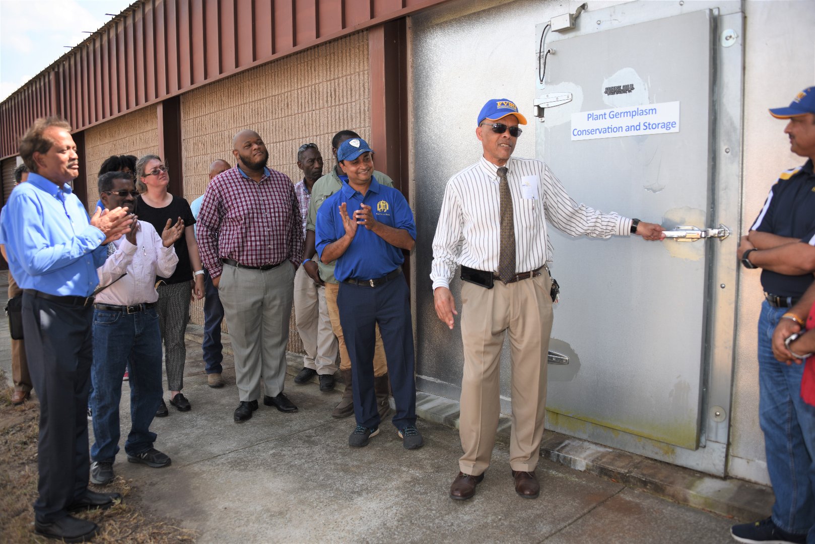 Noble opens the door to the new germplasm conservation walk-in cold storage unit on the university’s farm.