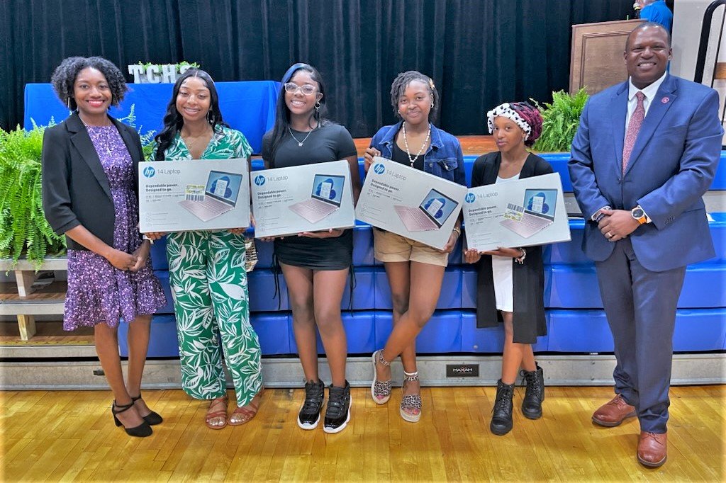 Turner County High School Principal Jason Clark (far right) recognizes the Writer’s Playground program creator Latasha Ford (far left) and writers (from second left) Taylor Hardin, Erica Peak, Olivia Wilson and Jada Poteau during the Honors Night banquet on April 25, 2023. Each student received a laptop and certificate.