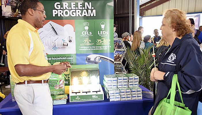 Energy educator, Billy Brown, speaks with a visitor at the GREEN program display at the Sunbelt Ag Expo 2017.