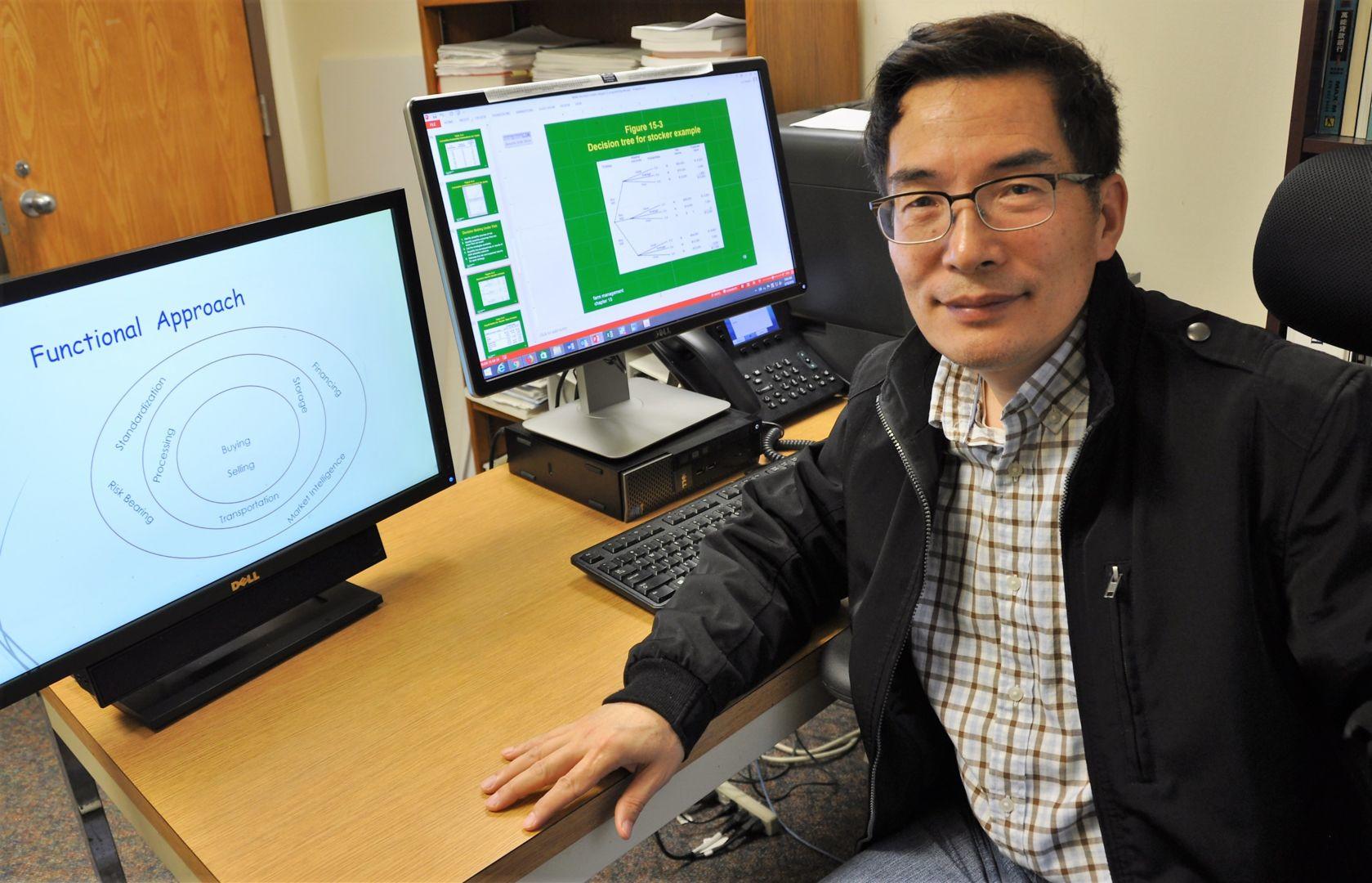Fort Valley State University expert Dr. Xuanli Liu at work in his office on campus.