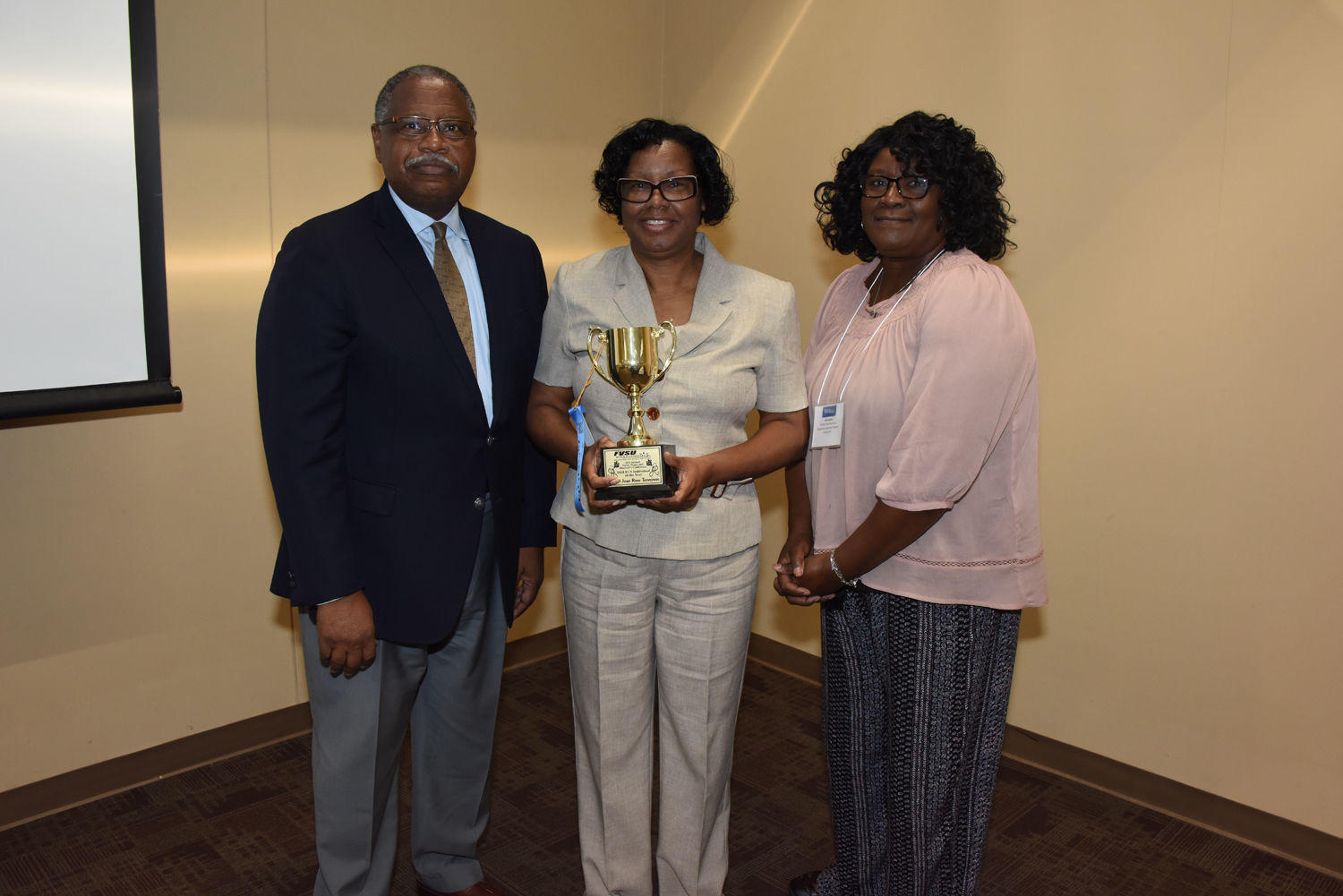 Sheryl Tennyson (center) a counselor at Hunt Elementary School, received the 2018 Family Consumer Sciences award at the Farm, Home and Ministers Conference. Presenting the award to Tennyson is Dr. Mark Latimore, FVSU extension administrator (left), and Ga