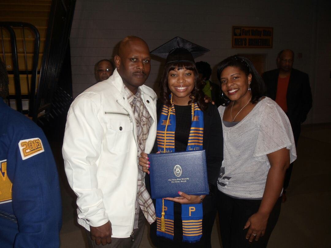 Shown with her parents, Stallworth flashes her Wildcat smile after graduating from FVSU with a bachelor’s degree in pant science and biotechnology in 2011.