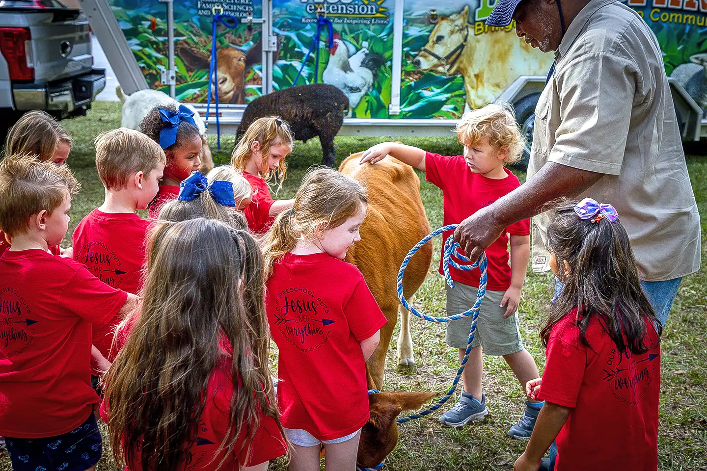 Children learning about farm animals.