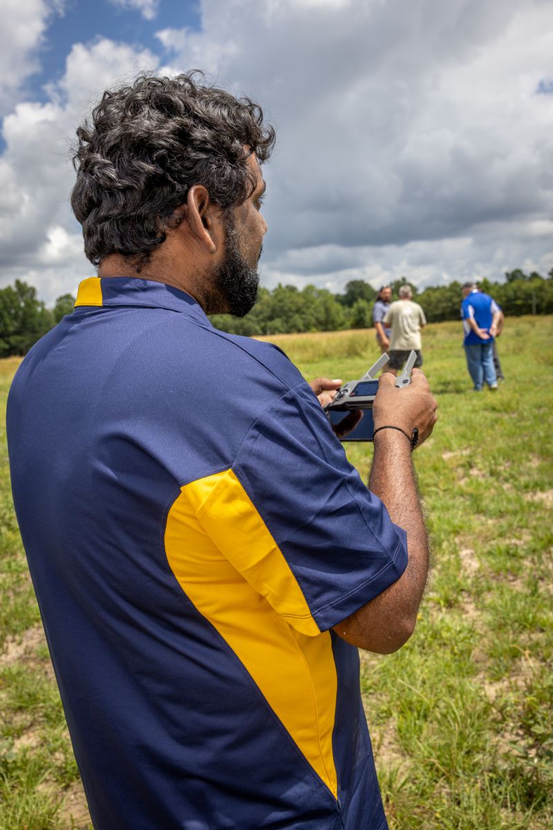 Siddique pilots a drone to inspect a Georgia farmer’s land from above.