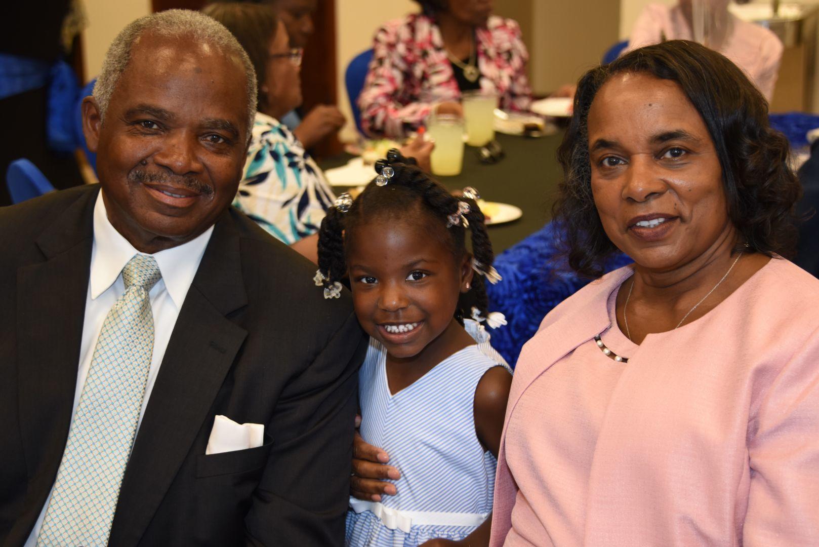 Fluellen’s husband, Jared Fluellen Sr. (FVSU’s farm manager), and their granddaughter, McKenna Elizabeth Lee Carter, celebrate her retirement.