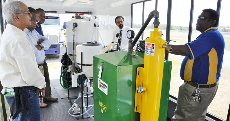 Dr. Sonny Ramaswamy's (left), newly appointed director of the U.S. Department of Agriculture's National Institute of Food and Agriculture agency, toured Fort Valley State University's agricultural facilities including this mobile unit that produces biofue