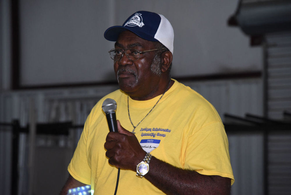 Hezekiah Backey, a local farmer, addresses attendees during the Southern Farmers Collaborative Group conference at the Worth County Agricultural Pavilion on January 12, 2018.