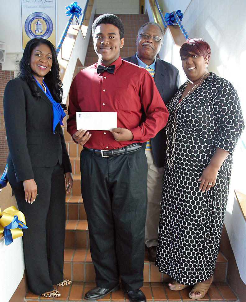 Keavoydre Buchanan, a freshman agriculture education major, (center) received the 2016 James Harrison Hill, Sr. Book Scholarship. Kristie Kenney, director of the FVSU Foundation Inc., (left) Yolanda Hurst Hill, (right) wife of the late James Harrison Hill Sr., and Dr. Mark Latimore Jr., FVSU extension administrator, present him with his scholarship.