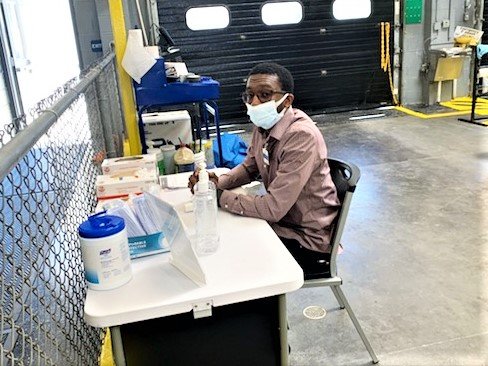 Kelly assists with checking 200-plus employees at his Warner Robins location.