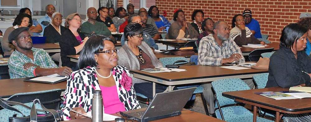 Farmers, county agents, Fort Valley State University Extension personnel and clients pay close attention to a presentation during the Agriculture Production Farmers-to-Farmers Workshop at the Dougherty County Extension Office Dec. 7, 2012 in Albany, Georgia.