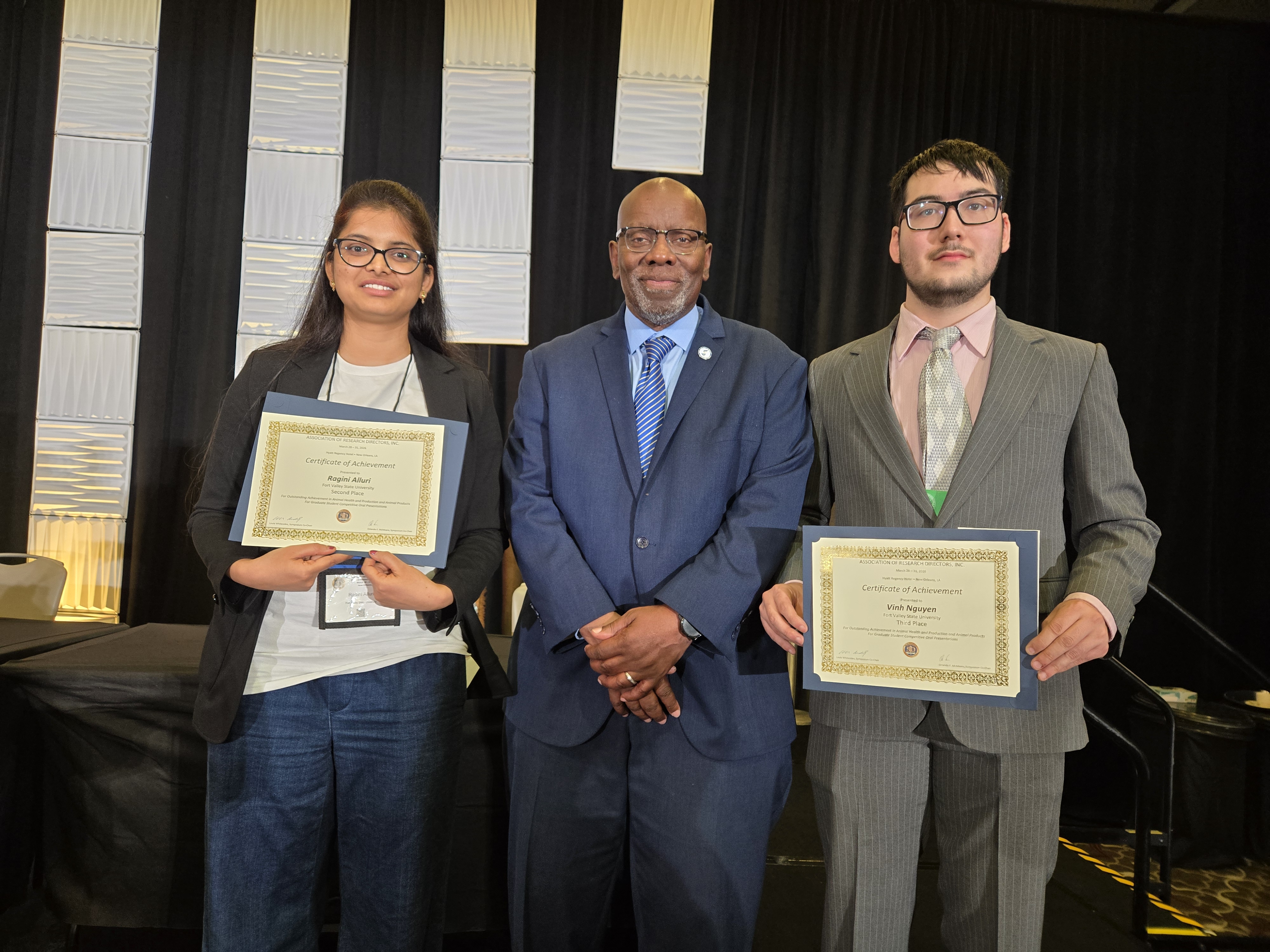 Ragini Alluri and Vinh Nguyen, with Keith Howard, Ph.D., hold their certificates of achievement.