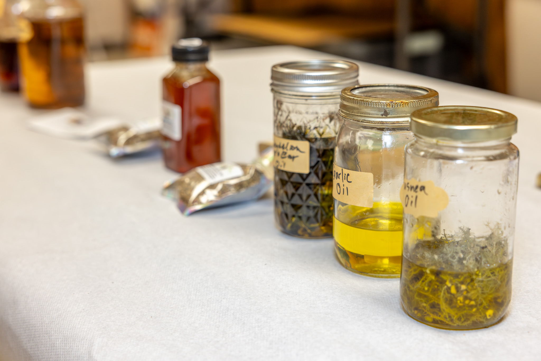 Herbs on table in jars.