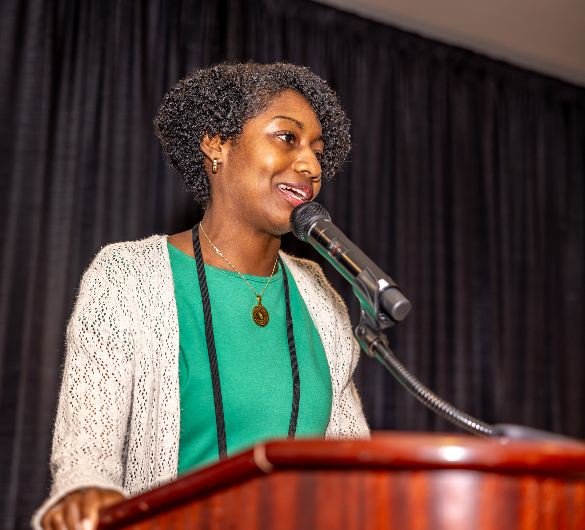 Latasha Everson speaks at podium